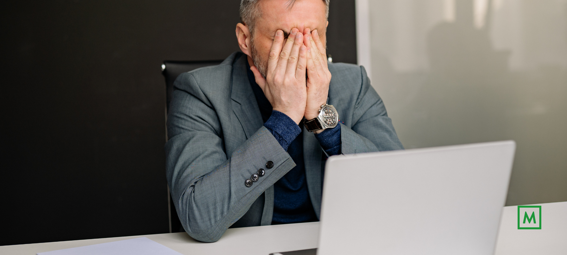 1. Stressed man at desk